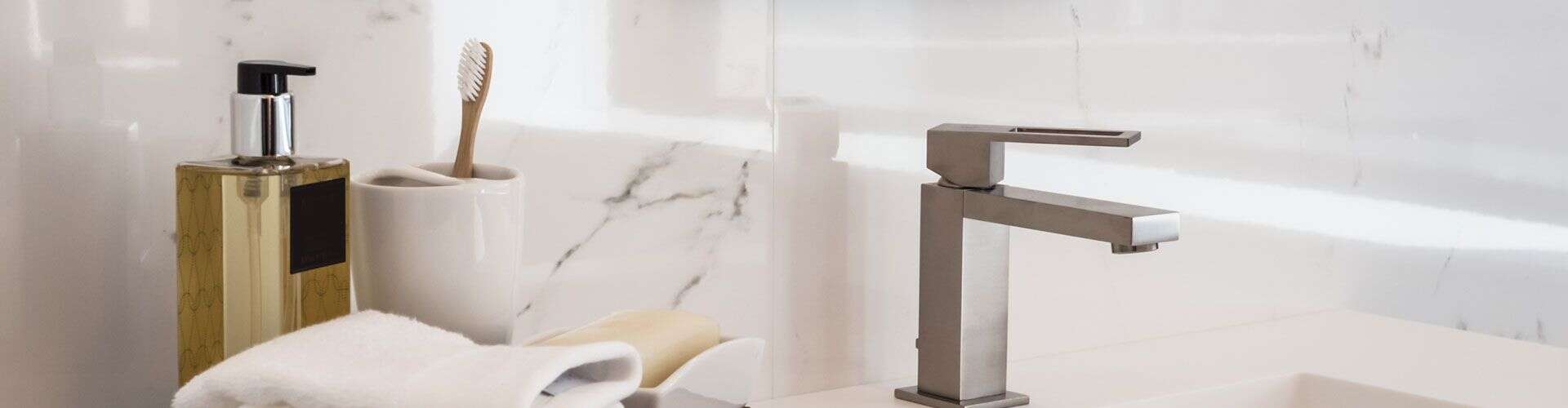 Modern bathroom sink with plumbing fixtures in renovation project.