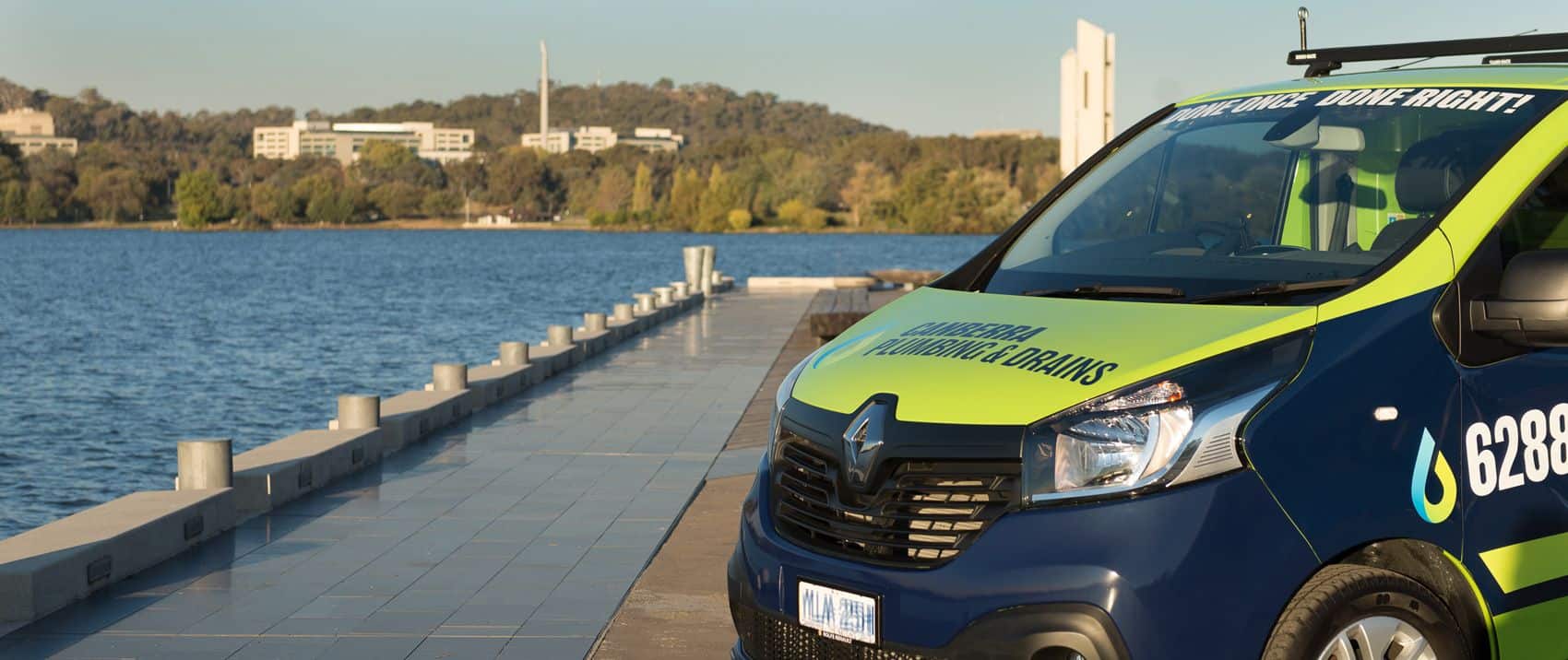 Canberra Plumbing & Drains van parked near Inner South waterway.