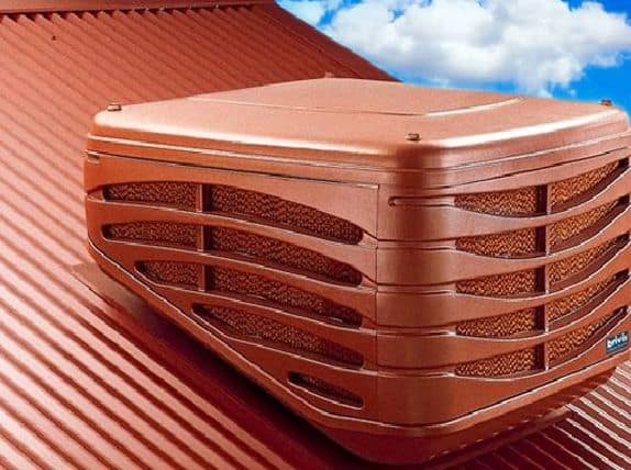 Evaporative cooler installed on a rooftop for efficient cooling.